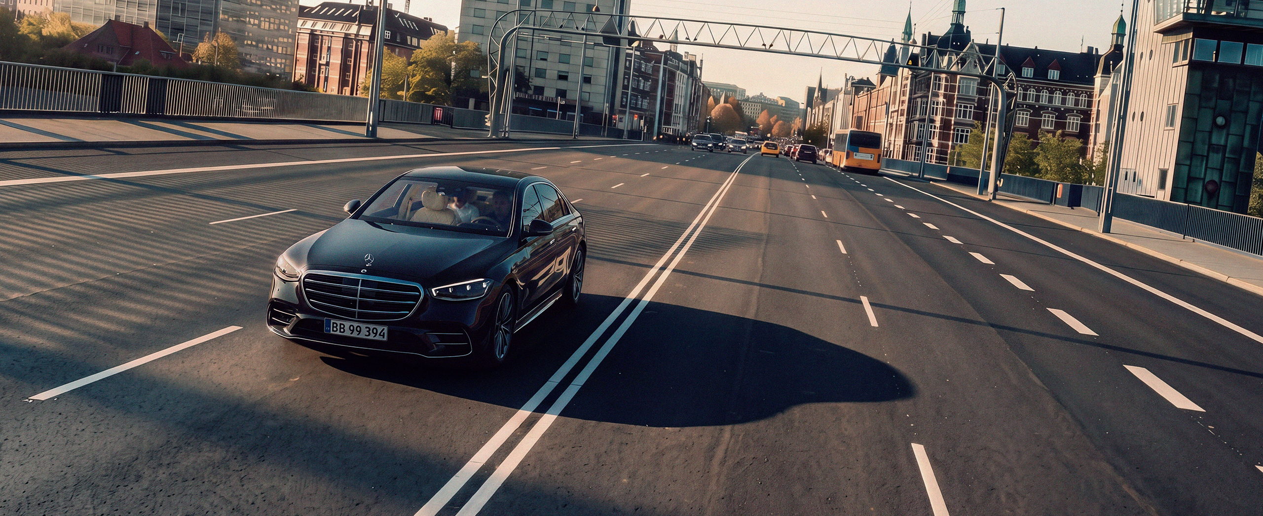 Chauffeured Mercedes on a city boulevard